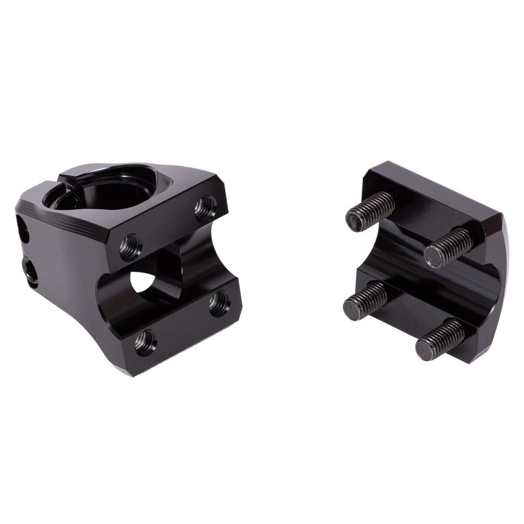 The Wethepeople Index Front Load Stem features two black metal clamp pieces with bolt holes and three attached bolts, designed to fit together as a BMX stem with a 16mm rise, shown against a white background.