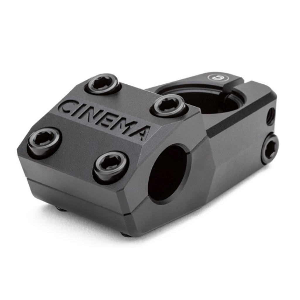 The Cinema Analog Low Top Load Stem features a black metal finish, is crafted from 6061-T6 aluminum, has "CINEMA" engraved on the front, and uses six hex bolts to secure the classic Cinema clamp areas.