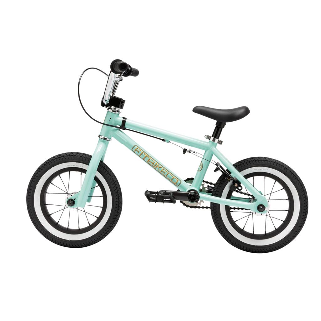 The Fit Misfit 12 Inch Bike is a small, light blue kids' pedal bike featuring black tires, a black seat, and silver handlebars, displayed from the side on a white background.
