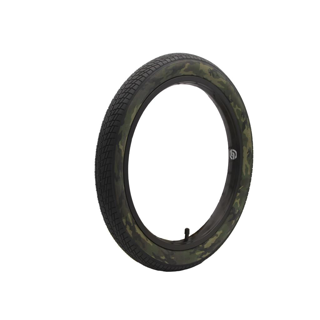 The DRS Arrow 18 Inch Tyre, sized 18 x 2.25 with a black tread and green camo sidewall, stands upright on a white background. This stylish and durable tyre is perfect for boosting your bike's look and performance.