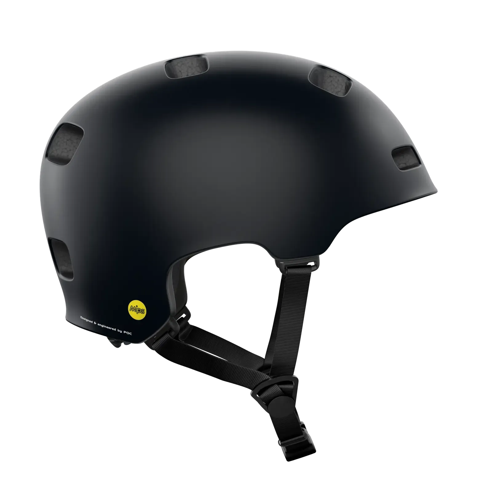 The POC Crane MIPS Helmet in matte black features a skate-style design with multiple vents, an adjustable black chin strap, a small yellow circular sticker on the back, and a dual-density liner for enhanced protection against rotational impacts.