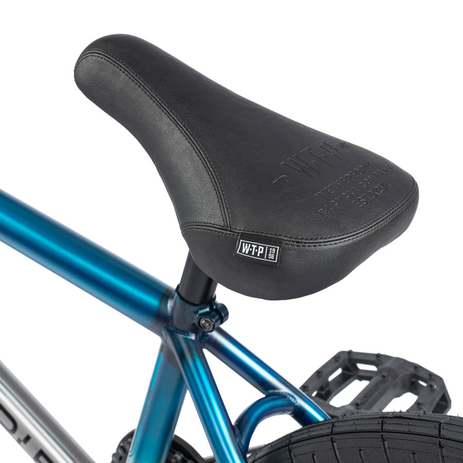 A blue Wethepeople Reason 20 Inch BMX Bike with a black seat.