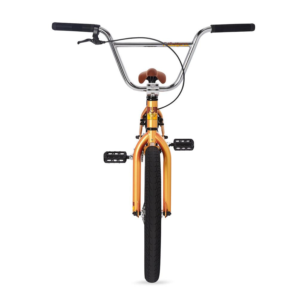 Front view of the Fit Series One 20 Inch Bike (2023) in orange, featuring black handlebars, pedals, and a brown seat against a white background—ideal as an entry-level BMX for new riders.