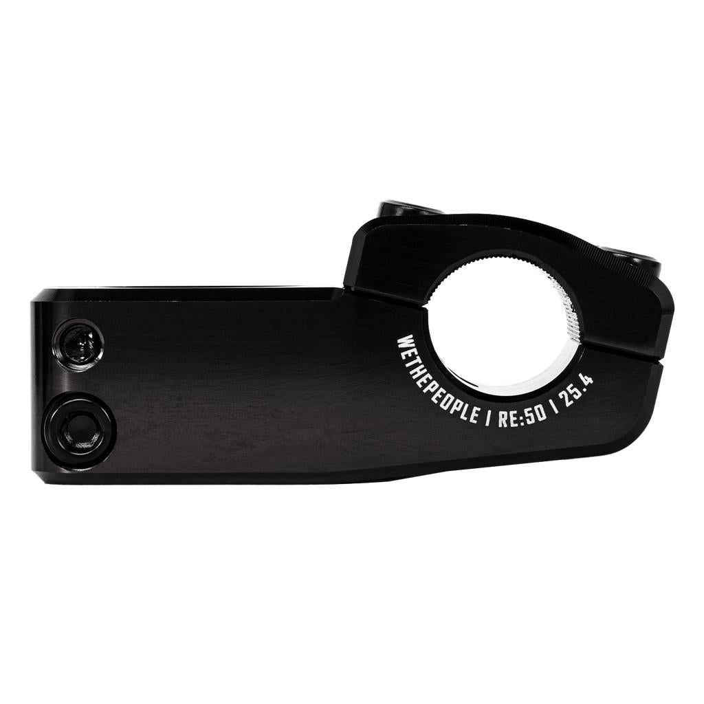The Wethepeople Logic Oversized Top Load Stem (25.4mm Clamp) is black with two bolt holes on the left and "WETHEPEOPLE RE:50 25.4" printed near the circular clamp area on the right.