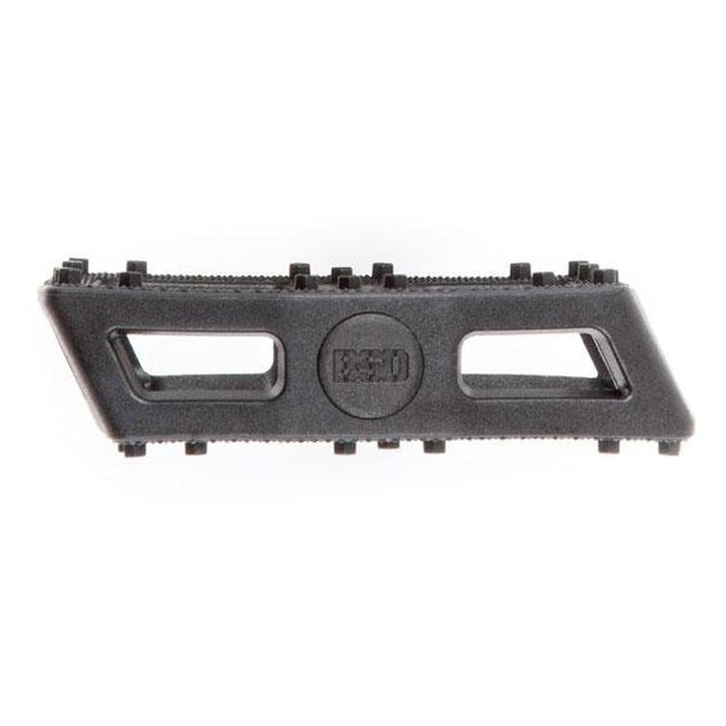 BSD Safari PC Pedals shown from the side, featuring durable nylon fiberglass construction with two rectangular cutouts and a textured top edge for grip, resembling a black plastic razor blade scraper.
