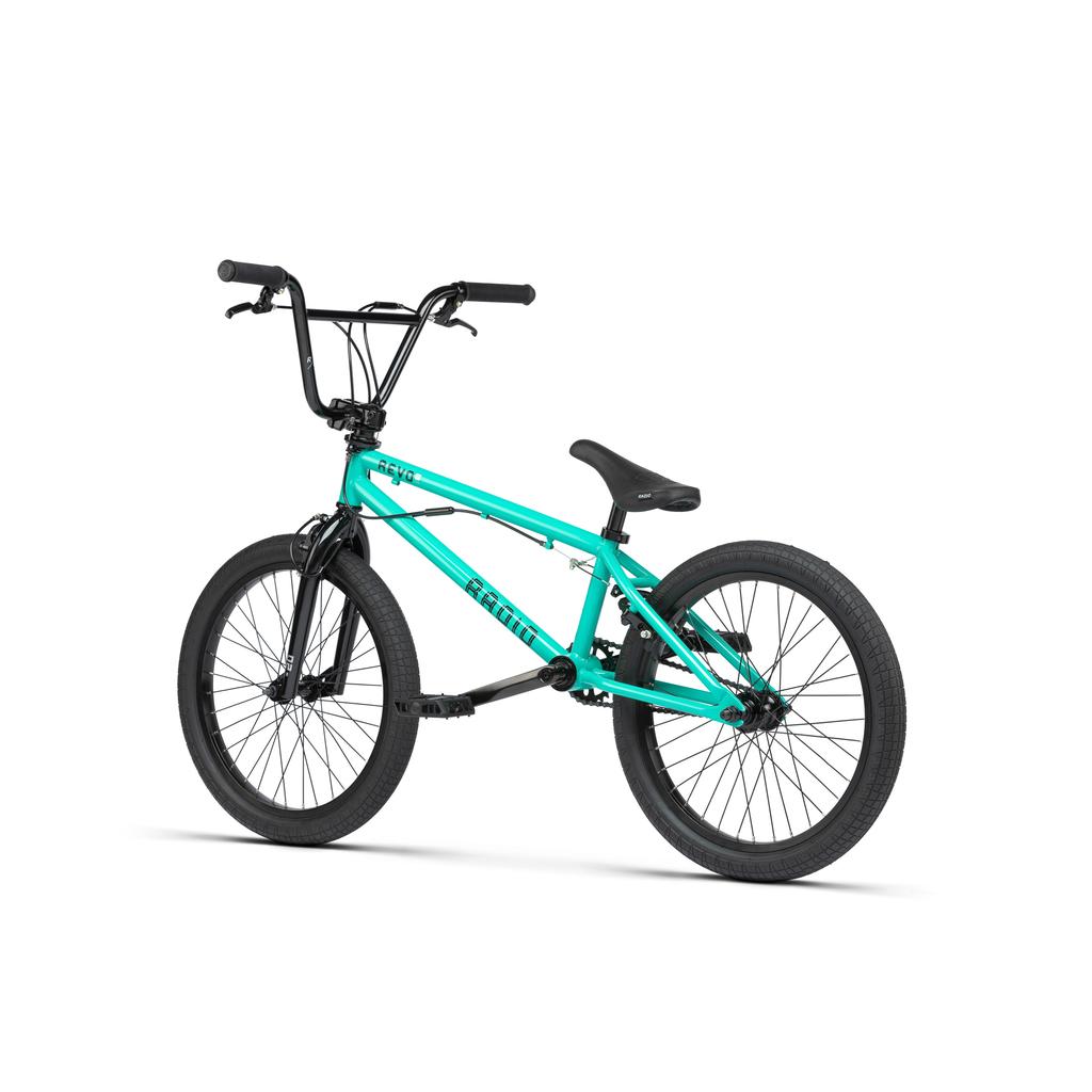 The Radio Revo Pro FS 20 Inch Bike features a teal frame with a 20-inch top tube, black handlebars, seat, and tires, displayed from the side on a white background.