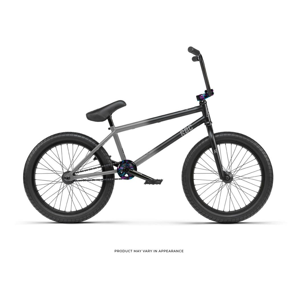 Side view of a black Radio Comrad 20 inch Bike featuring thick tires, upright handlebars, full chromoly frame, and padded seat on a white background.