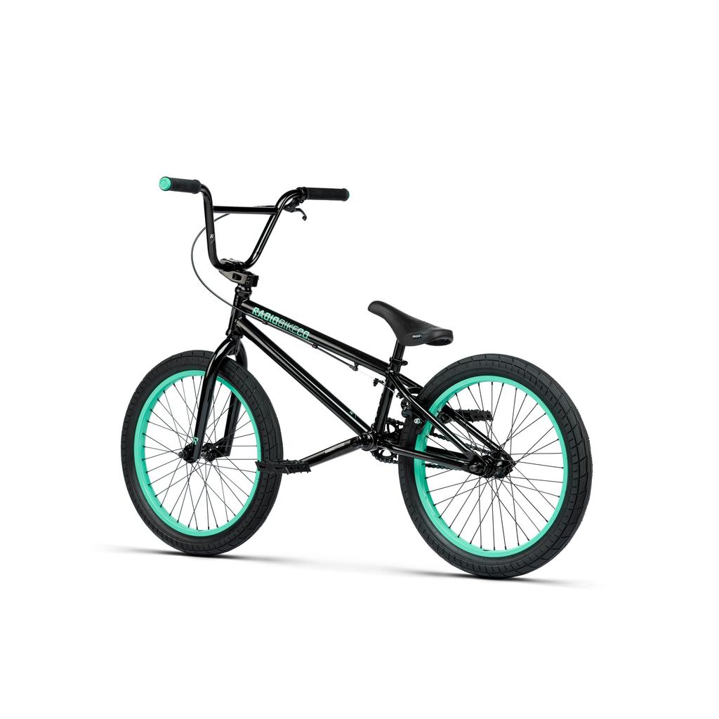 The Radio Saiko 20 Inch Bike, black with teal handlebar grips and wheel rims, plus Salt Tracer Tyres, is displayed on a white background.