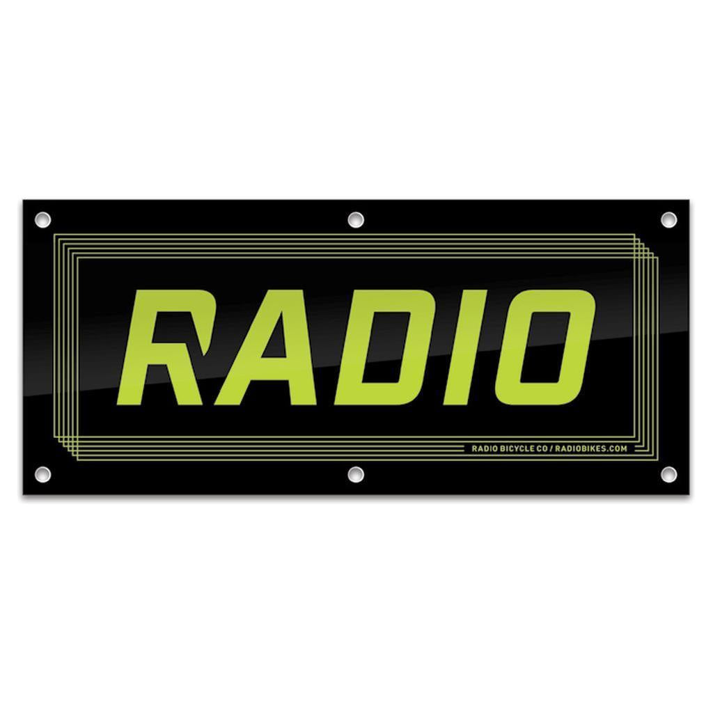 The Radio Shop Banner features "RADIO" in bold yellow-green letters on a black rectangular background with a thin geometric border—ideal for shop displays or as an eye-catching banner for event decor.