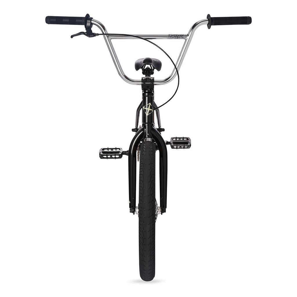 Front view of a black Fit TRL Bike (2023) BMX bicycle, showcasing trail geometry BMX design with handlebars, front wheel, pedals, and brake cable against a white background.