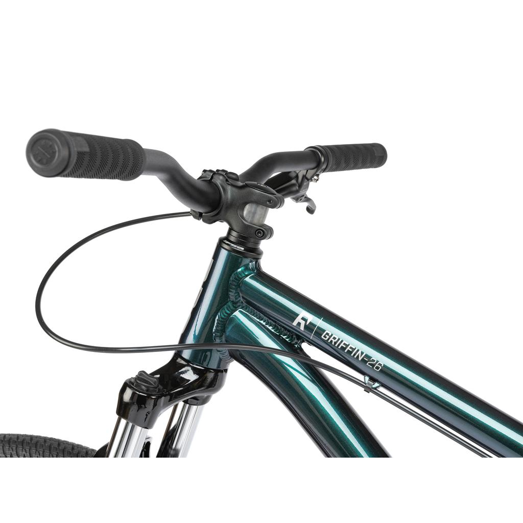 Close-up of the Radio Griffin 26 Inch Bike’s metallic green frame with "GRIFFIN-26" logo, handlebars, and front fork, equipped with Maxxis DTH tyres for enhanced performance.