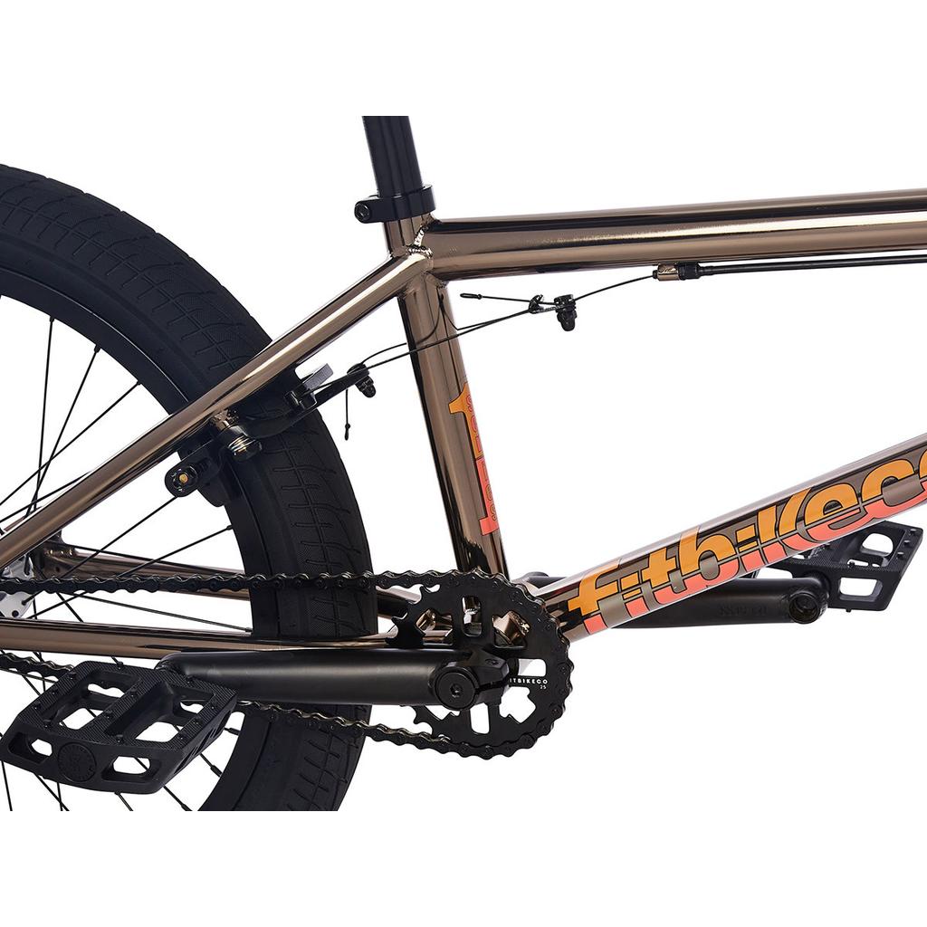 Close-up of a Fit Series One 20 Inch Bike (2023) frame highlighting the chain, crankset, pedals, rear tire, brake cable, and partial "Fitbikeco" logo.