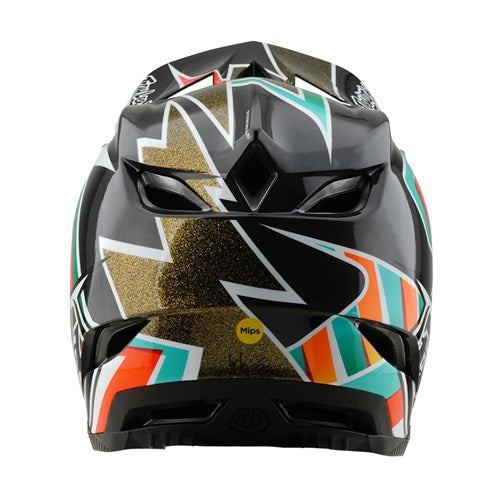 The TLD 25.1 D4 Carbon Helmet (MIPS) in Black/Gold features colorful geometric patterns with orange, teal, and glittery gold designs on a black base. It's perfect for downhill BMX enthusiasts, offering MIPS protection for enhanced safety.