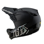 The TLD 25.2 D4 CARBON HELMET MIPS STEALTH BLACK is a matte black full-face helmet with white geometric graphics, visor, Mips protection, and vent openings—perfect for downhill mountain biking; shown in side view.