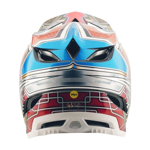 A close-up of the TLD 25.2 D4 CARBON HELMET MIPS LOWRIDER BLUE showcases vibrant blue, red, and silver designs, black vents, and a yellow "Mips" sticker indicating advanced protection for mountain biking.