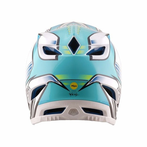 A rear view of the TLD 26.1 D4 AS Composite Helmet in Crest Real Teal shows teal and white colors, black and gray details, ventilation openings, a yellow Mips protection sticker, and a signature near the base.