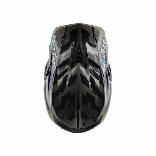 The TLD 26.2 D4 Composite Helmet / MIPS Burst Grey is a black and gray full-face mountain biking helmet, shown from a top-down view, with striking blue “Troy Lee Designs” logos on each side and advanced Mips protection for enhanced safety on the trails.
