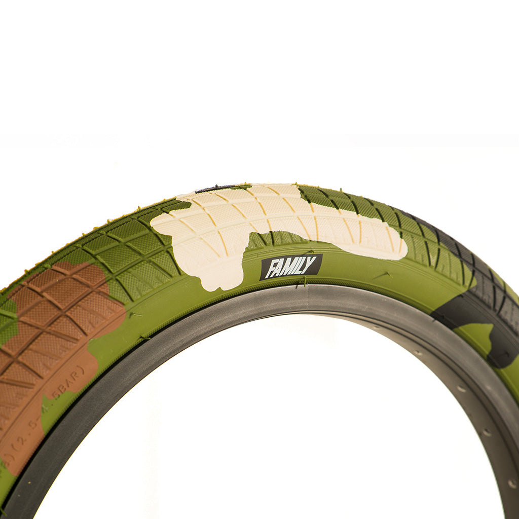 A Family BMX F2128 16 Inch Tyre blending into a white background with camouflage pattern.