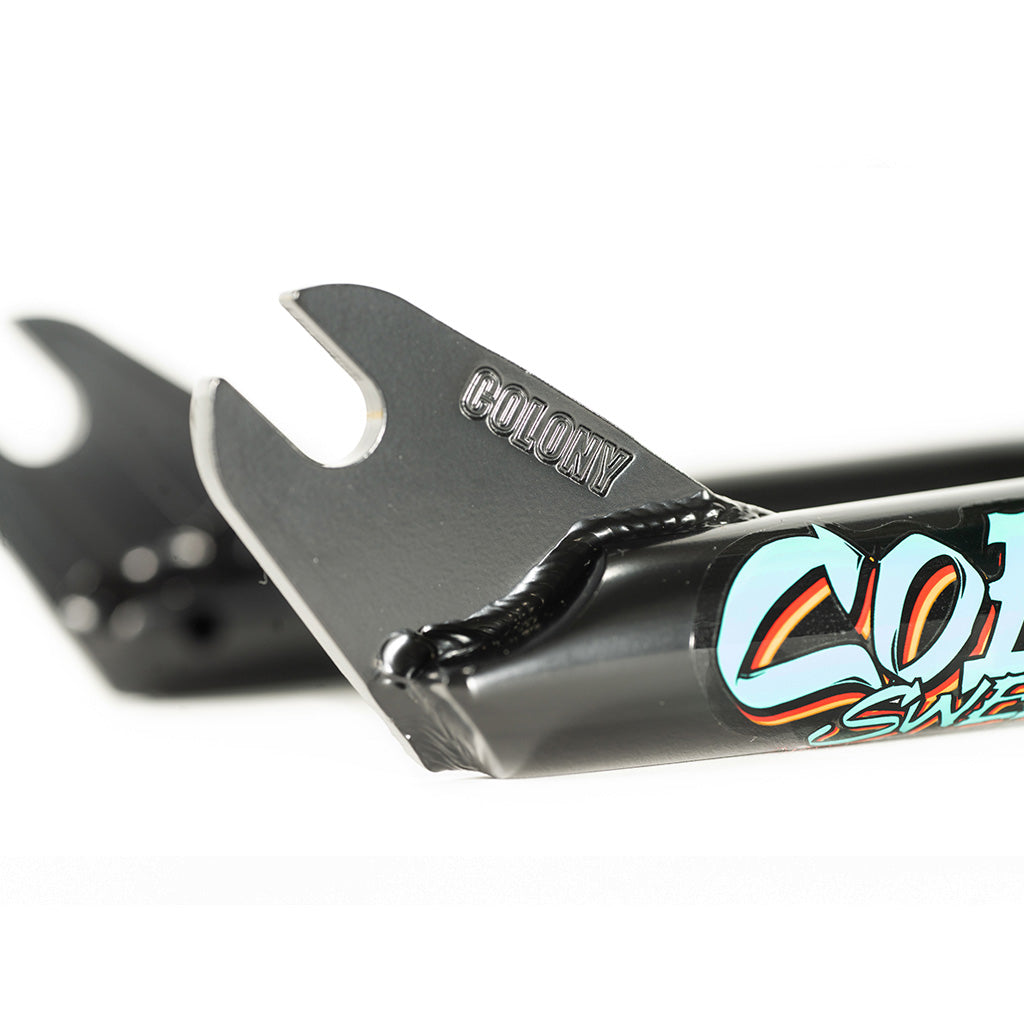 A pair of light-weight Colony Sweet Tooth 16 Inch Fork handlebars with the word Coca Cola on them.