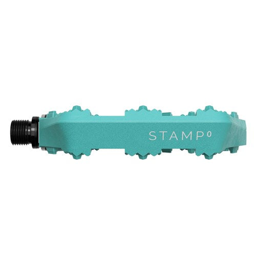 Side view of a teal Crank Brothers Stamp 0 Pedal (Small) with a composite body, metal pins for grip, and "STAMP 0" printed on the side.