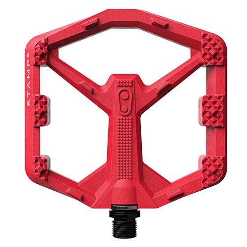 The Crank Brothers Stamp 0 Pedals (Small) feature a red composite body for durability, textured grip for maximum traction, "STAMP" labeling on the side, and a black threaded spindle for easy bike attachment.