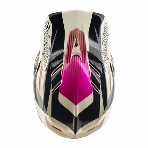 A top view of the TLD D4 Polyacrylite Helmet in Turbo Acid/Fuchsia showcases bold black, white, and pink geometric patterns with “Troy Lee Designs” text on each side—engineered for mountain biking and equipped with Mips brain protection.