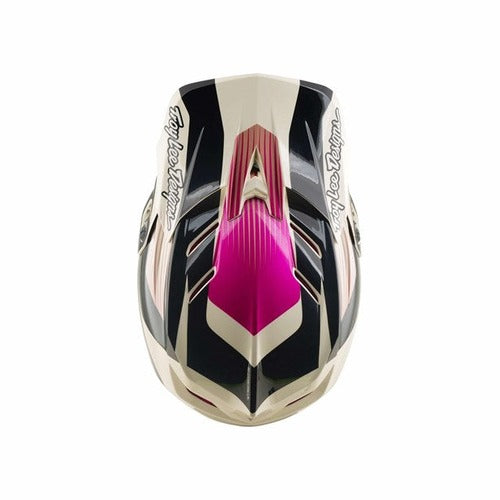 A top view of the TLD D4 Polyacrylite Helmet in Turbo Acid/Fuchsia showcases bold black, white, and pink geometric patterns with “Troy Lee Designs” text on each side—engineered for mountain biking and equipped with Mips brain protection.