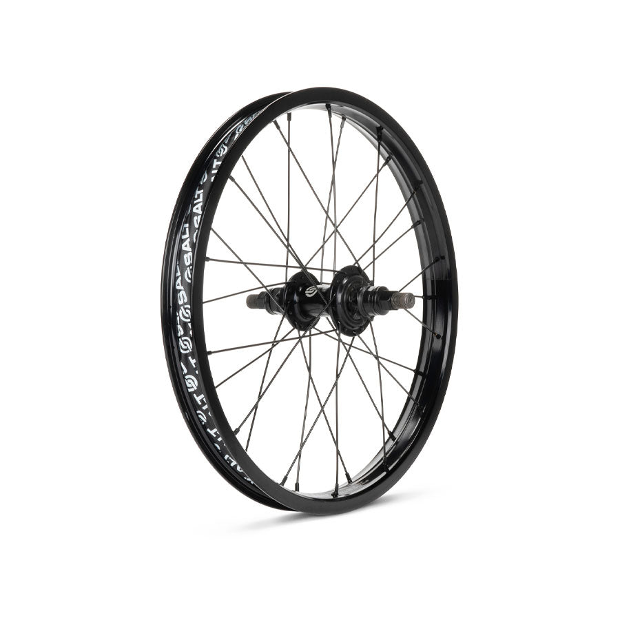 A bicycle wheel with black spokes and a Salt Rookie Cassette 18 Inch rear wheel, featuring visible branding, isolated on a white background.