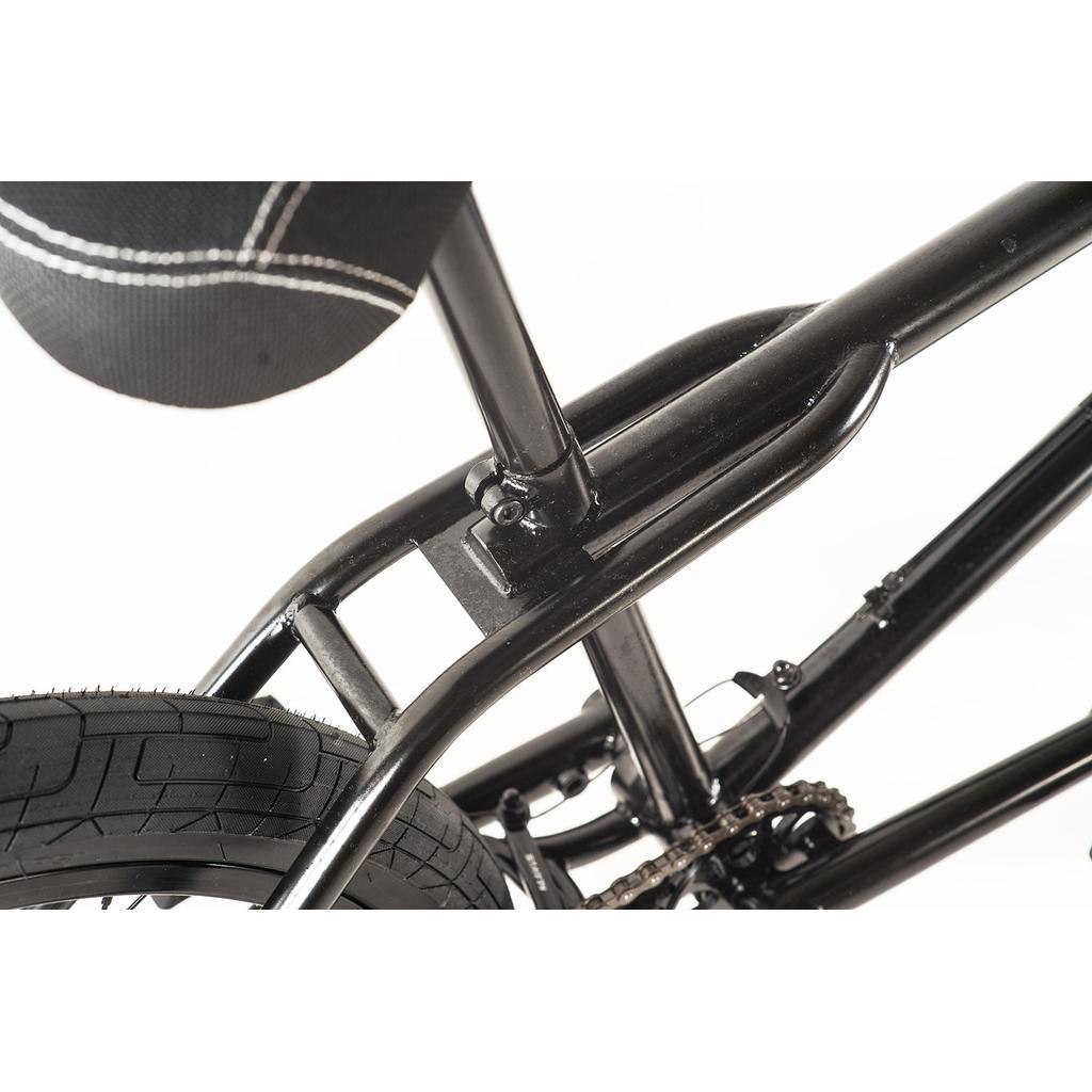 Close-up view of the Colony Prody Pro 20 Inch Bike’s black limited edition frame, featuring the seat, rear tire, chain, and part of the drivetrain against a white background.
