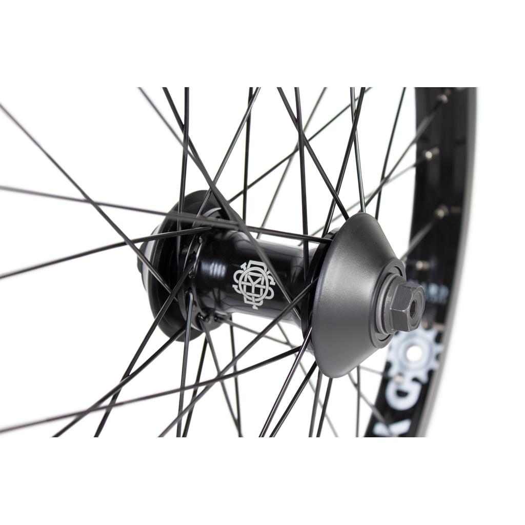 Close-up of a black Odyssey Vandero Pro Hazard Lite Front Wheel with spokes radiating outward and a white logo on the hub.