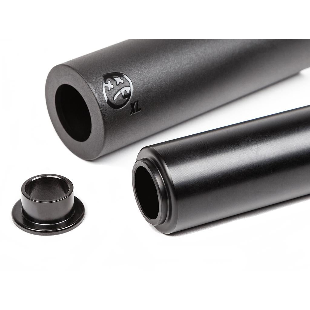 Two matte black cylindrical BSD Rude Tube LT V2 Plastic Pegs are displayed on a white background, along with a small detached metal ring.