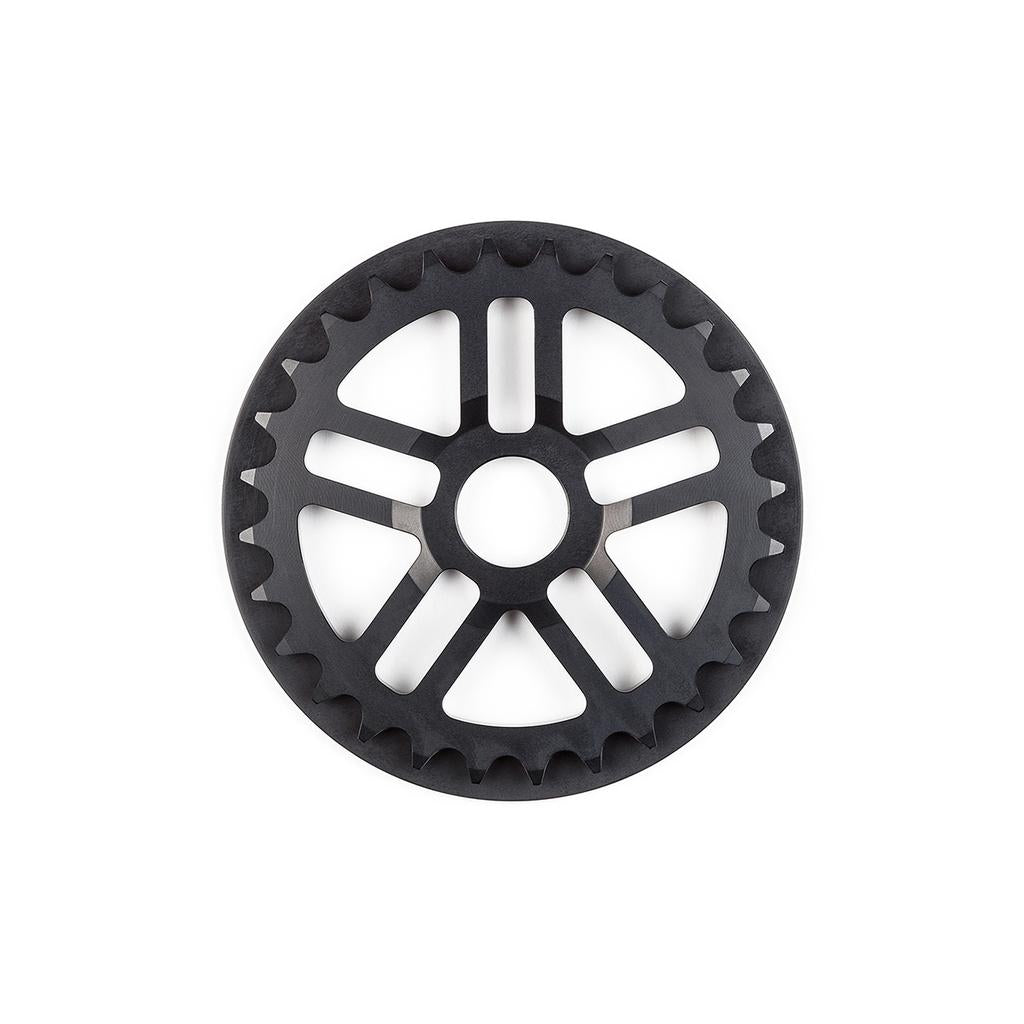 The BSD Guard Sprocket is a black sprocket featuring evenly spaced teeth and five radial spokes, shown against a white background.