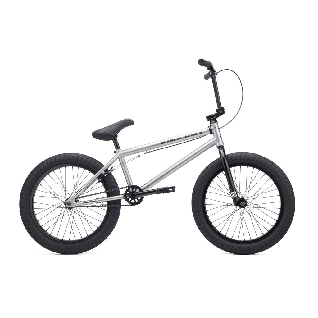 A Kink Whip 20 Inch Bike (2027) with a silver full Chromoly frame, black tires and seat, and straight handlebars, shown from the side against a white background.