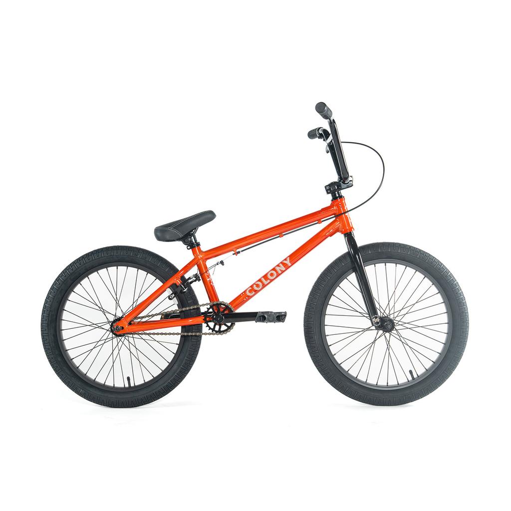 The Colony Horizon 20 Inch Bike features a bright orange frame with black handlebars, seat, tires, and pedals. Shown in side profile against a white background, it’s ideal for aspiring freestyle athletes.