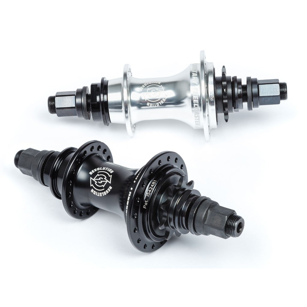 Two bicycle hubs, including a cassette hub and a BSD Revolution Rear Hub, on a white background.