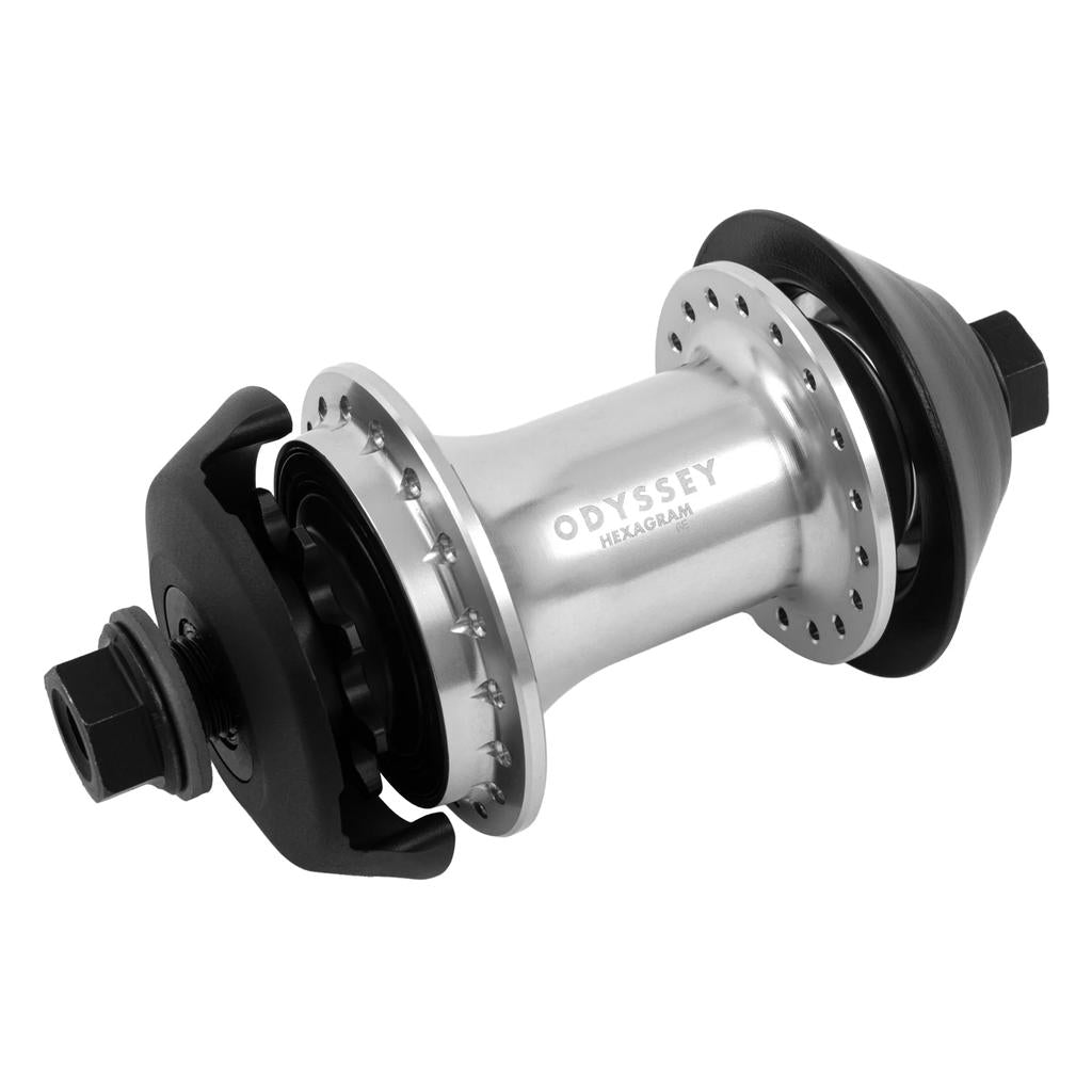 The Odyssey Hexagram Rear Cassette Hub in silver is shown against a white background, featuring black bolts, spoke holes, plastic hub guards on both sides, a switchable RHD/LHD design, and precision 6-pawl engagement.