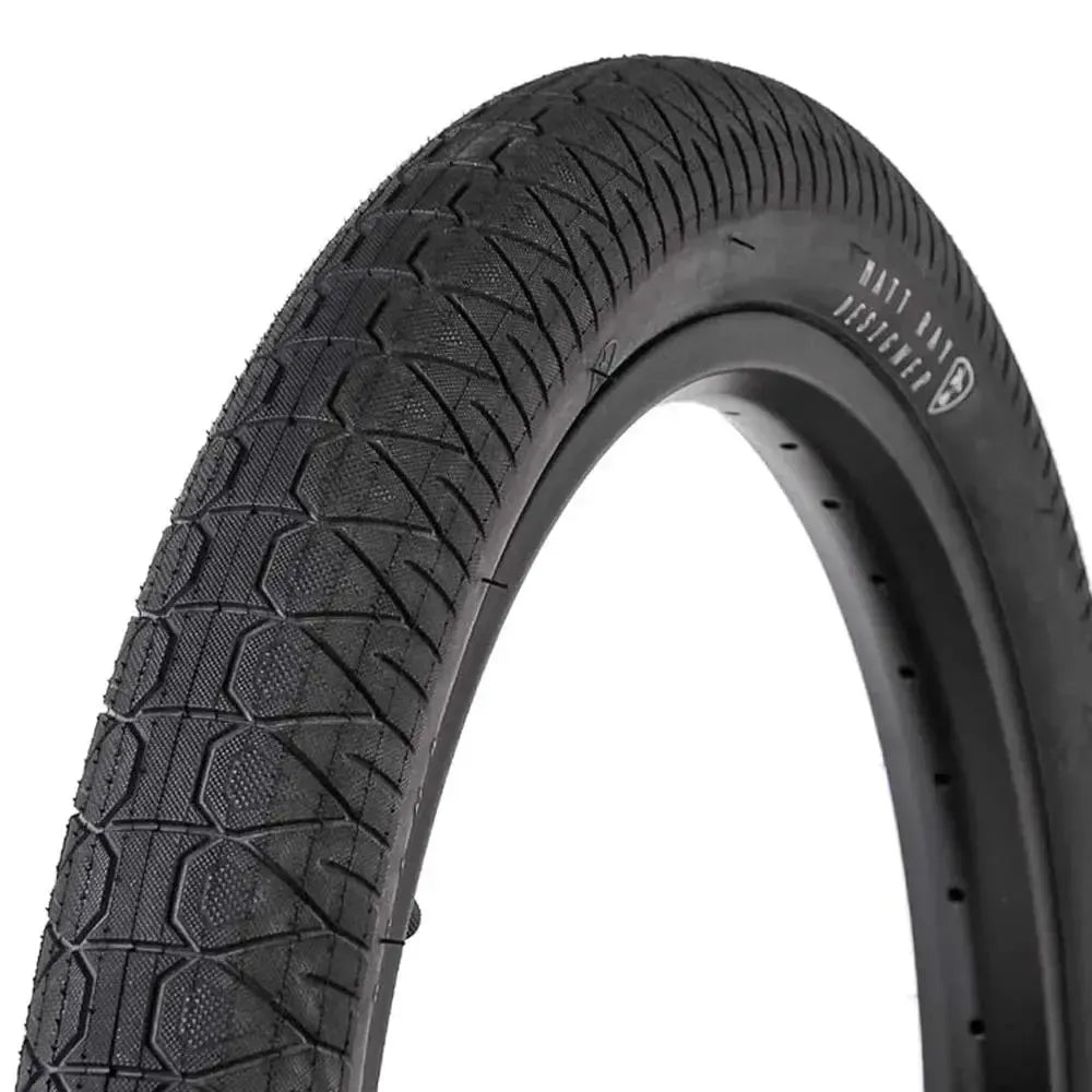 A close-up of the Subrosa Designer Tyre, a black BMX street tyre with a textured tread pattern, is shown against a white background.