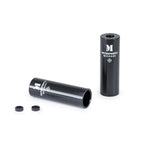 A pair of black Wethepeople Message Alloy Pegs, crafted from durable 7075-T6 alloy, with "WETHEPEOPLE MESSAGE" labeling and two small black rings, displayed on a white background.