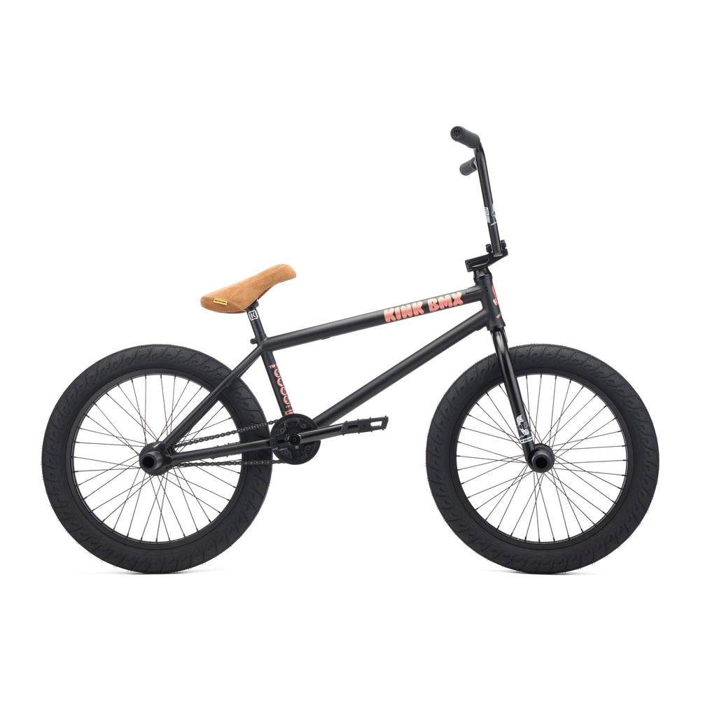 The Kink Williams 20 Inch Bike (2027) is a black chromoly BMX with thick tires, a tan seat, and no visible brakes, shown from the side against a white background.