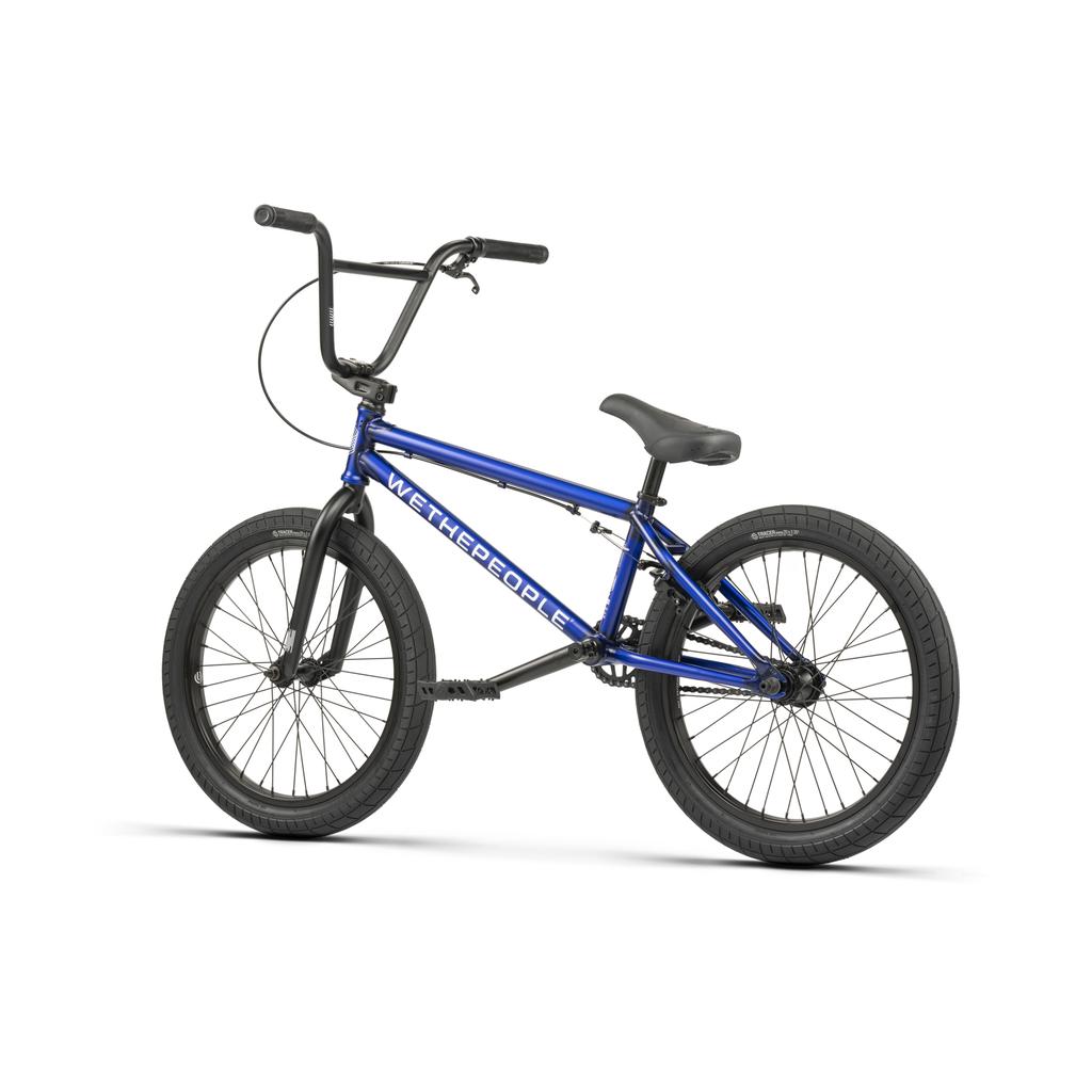 The Wethepeople CRS FC 20 Inch Bike is shown in profile on a white background, featuring a blue frame, freecoaster hub, black tires, and black handlebars.
