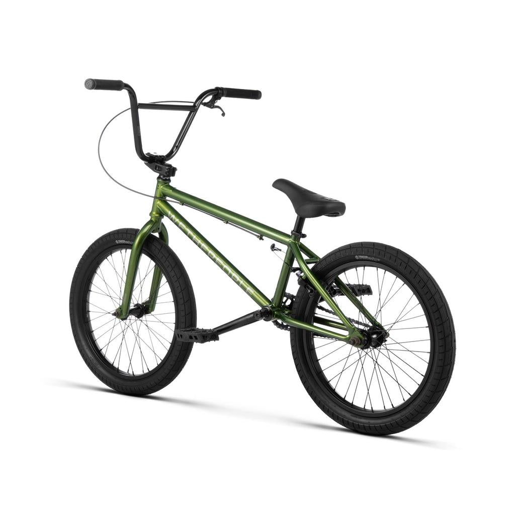 The Wethepeople CRS 20 Inch Bike is shown in green with black handlebars, seat, and tires, viewed from the rear left against a white background.