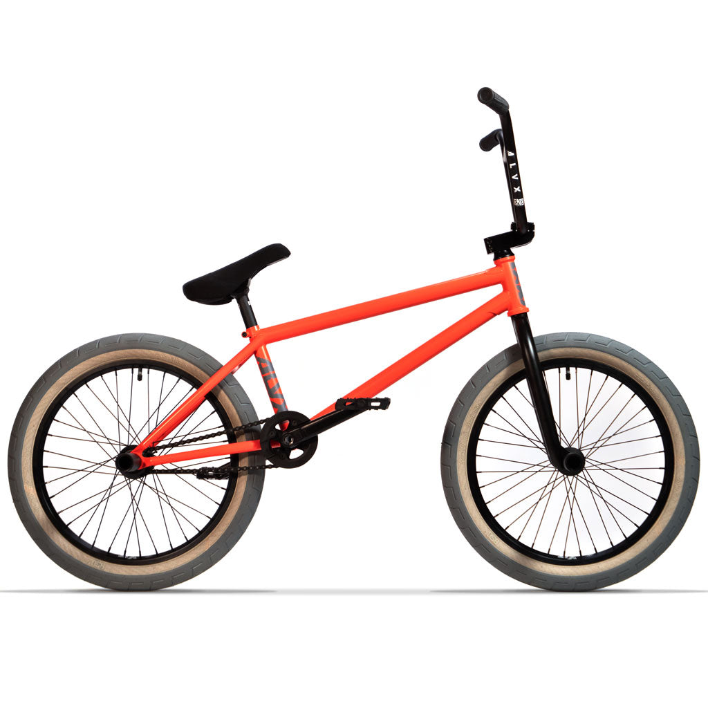 A vibrant orange BSD ALVX AF+ Custom 20 Inch Bike, featuring aftermarket parts, is showcased against a clean white background.