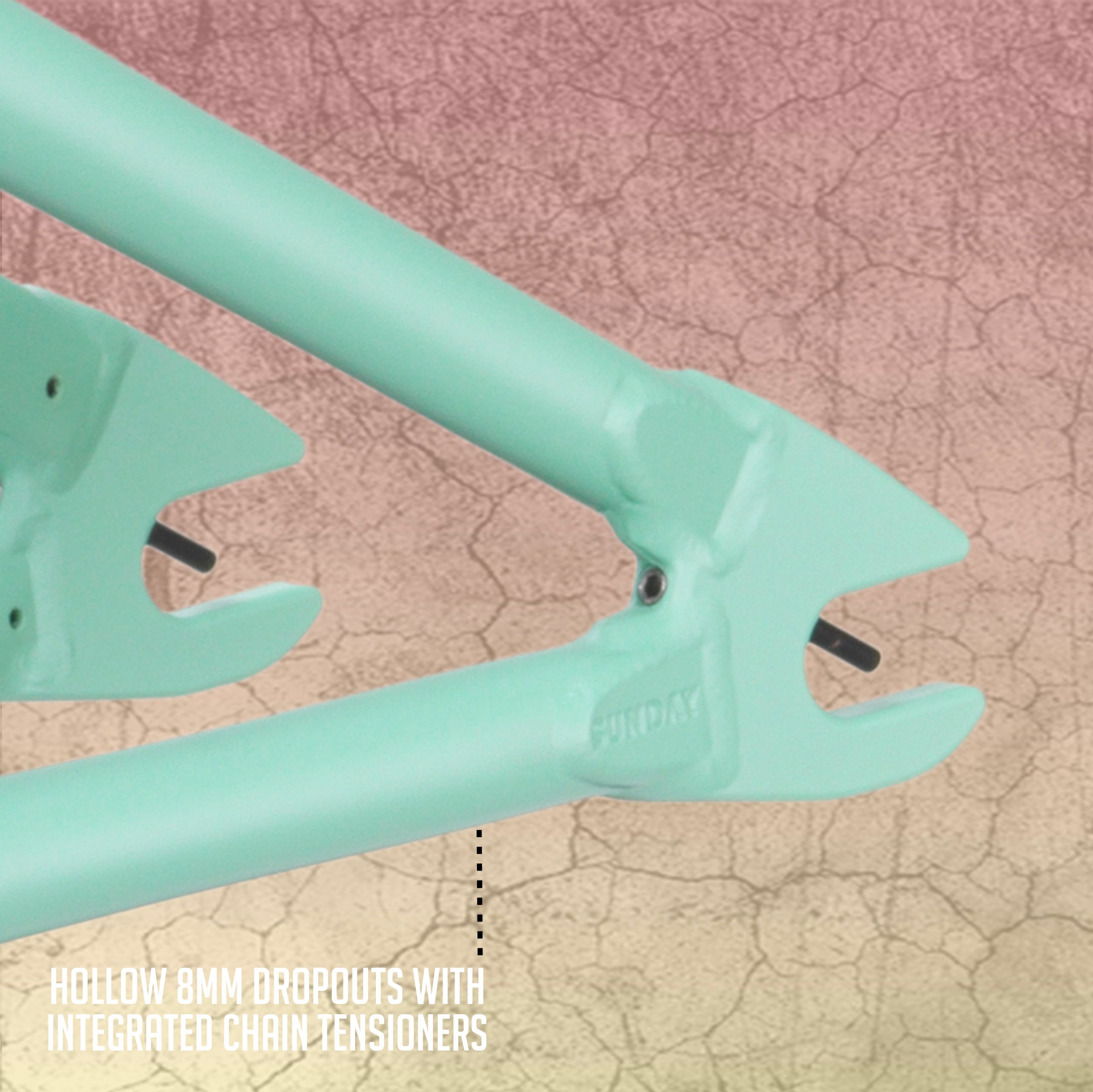 Close-up of the Sunday Ranger 18 Inch Frame in mint green, featuring hollow 8mm dropouts with integrated chain tensioners, set against a textured background.