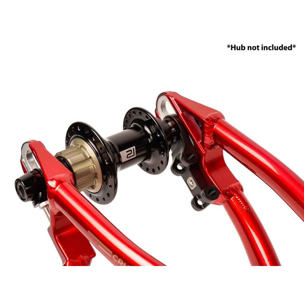 Close-up of a black rear hub mounted on the Radio Raceline Quartz 2025 Pro XL Cruiser Frame with red dropouts and sliding dropout disc system. Text in the corner reads “*Hub not included*”.