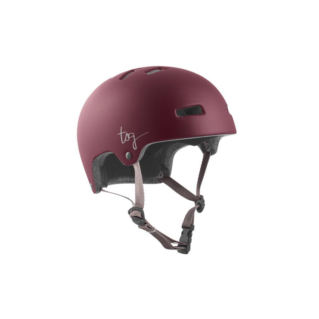 The TSG Nipper Maxi Helmet in Satin Cabernet is a maroon youth helmet featuring lightweight construction, ventilation holes, adjustable fit chin straps, and a small "tsg" logo on the side.