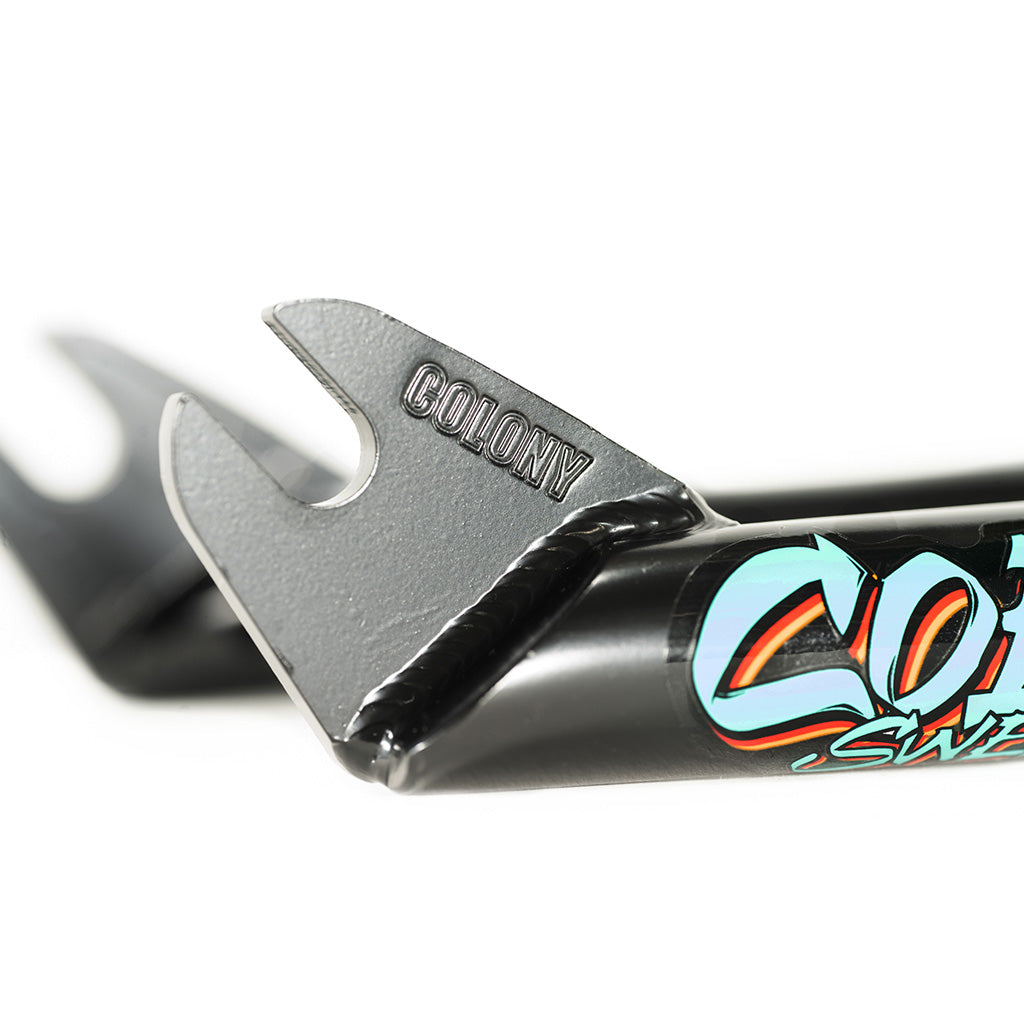 A close up of Colony Sweet Tooth Forks handlebar with a logo and durability on it.