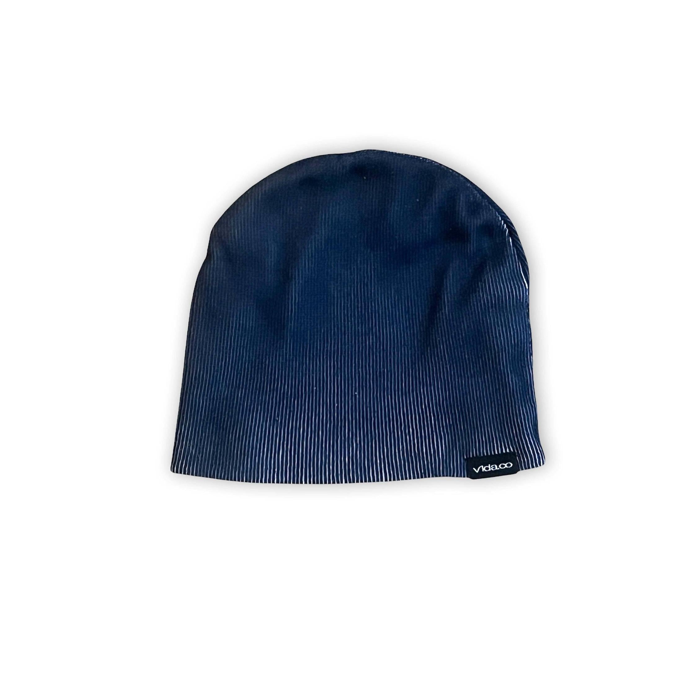 The V1DA Reversible Beanie is a navy blue acrylic hat with subtle vertical stripes and a small black Viclooo tag, available at v1da.co.
