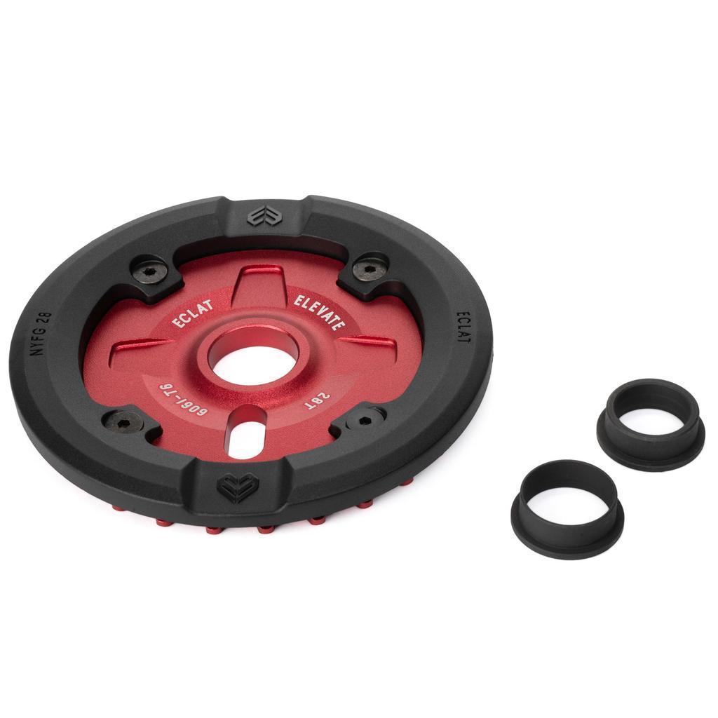 The Eclat Elevate Guard Sprocket, a red and black circular sprocket made from 6061-T6 Alloy, is shown with two black spacer rings on a white background.