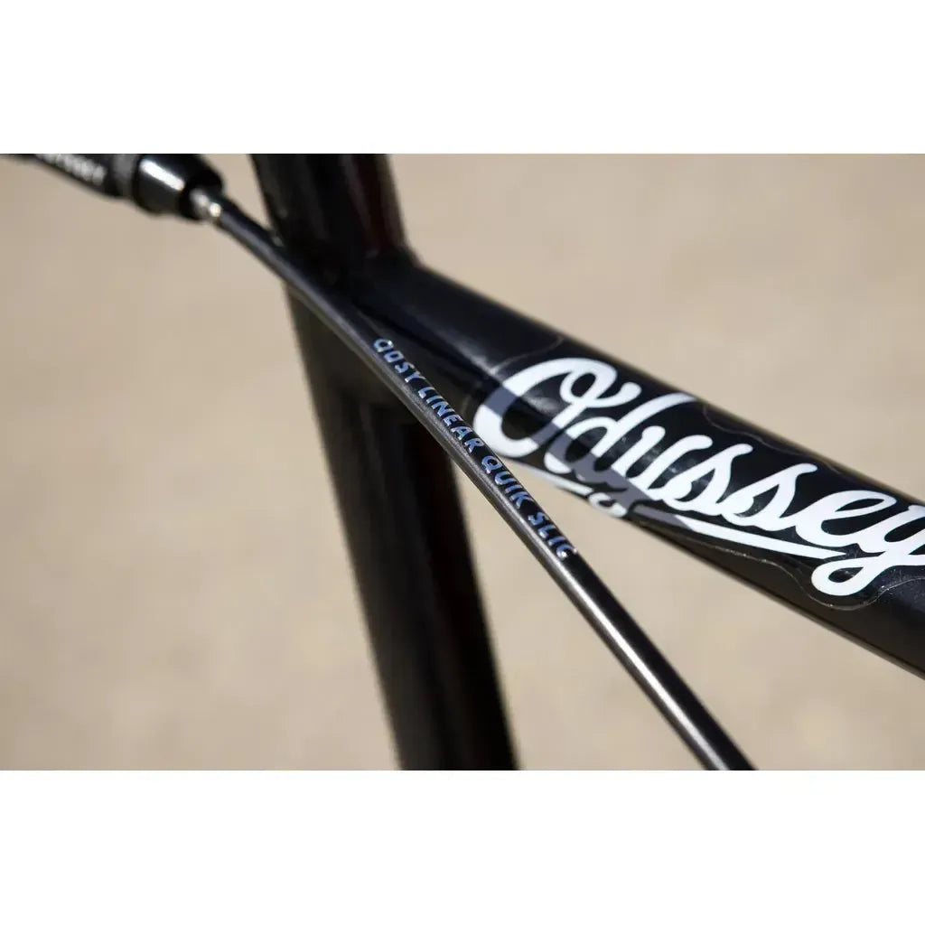 Close-up of a black Sunday Soundwave Special Bike (2025) frame with a visible Odyssey Linear Quik Slic brake cable and "Odyssey" in white script, highlighting quality Odyssey components.