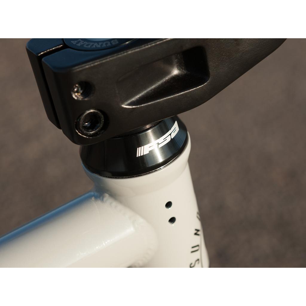 Close-up of a bicycle headset and stem, featuring the FSA logo on the headset, attached to a 100% chromoly frame from the Sunday EX Erik Elstran 20 Inch Bike.
